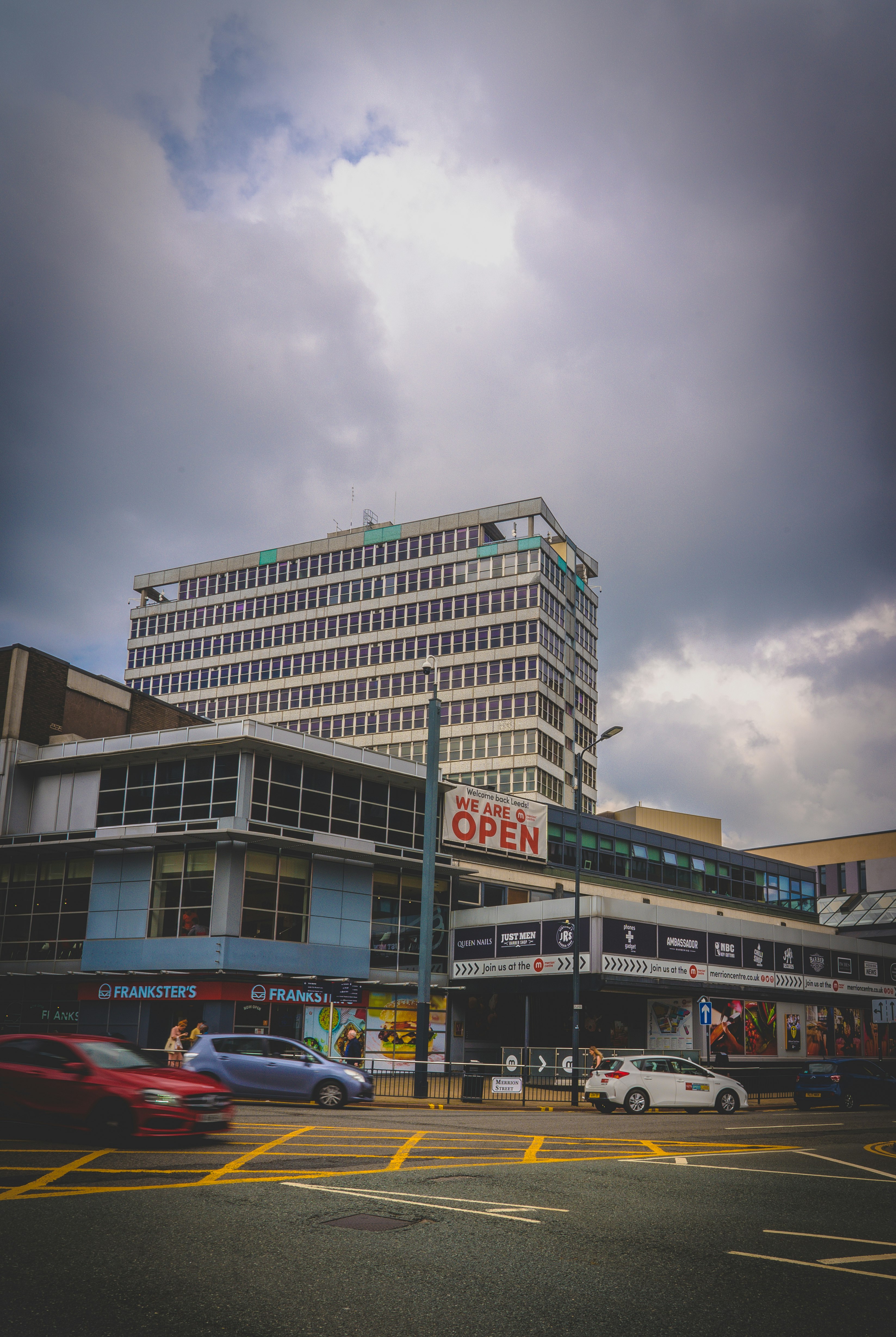 cars parked in front of building during daytime